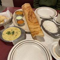 Potato and onion dosa. Idli. Coconut curry. Indian tea.   at Amma's Kitchen in Cincinnati