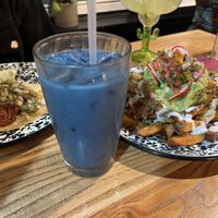 From left: barbacoa taco, butterfly pea flower horchata, asada fries  at Penelope's Vegan Taqueria in Chicago