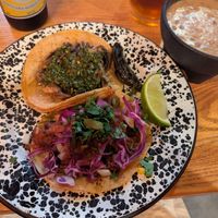 Soy al pastor and mushroom chimichurri tacos, with a side of beans - yum! at Penelope's Vegan Taqueria in Chicago