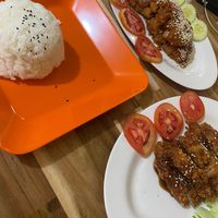Steamed rice, teriyaki chicken, and peanut chicken  at Reunion Cafe in Vientiane