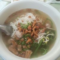 Vietnamese noodle soup with crispy pork 15k kip. Ask for it with fresh mint and Thai basil. Yummy but not super flavourful at Reunion Cafe in Vientiane