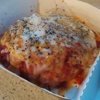 Pizza Roll* - Cinnaholic®'s signature dough rolled w/ savory marinara, Italian seasoning, & [vegan] Mozzarella & Cheddar shreds, topped w/ more sauce & "cheese" (*Seasonal) at Cinnaholic in Des Moines