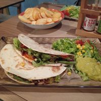 Vegan Wraps (one tofu, one seitan) with fries on the side, plus a wide variety of hot sauces at Bistro Toc in Split