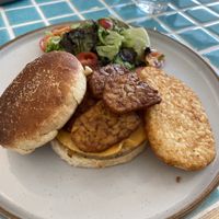 Sausage muffin with a hash brown, melted cheese added tempe bacon  at The Vegan Place in Kuala Lumpur