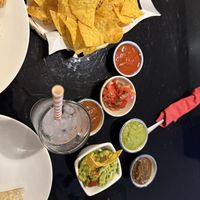 Sauces with different levels of spice  at Sunrise Tacos - Silom in Bangkok