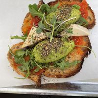 Toasted sourdough bread with tomato, avocado, homemade vegan cream cheese, arugula and microgreens  at Pantastic in Ibiza