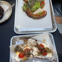 Bottom: toasted sourdough bread with tomato and homemade ricotta  at Pantastic in Ibiza