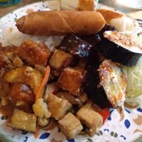 Whatever brunch 3 types of tofu dishes, aubergine dish, kimbap, spring roll, summer roll, rice and cabbage. at Whatever in Tampere