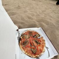 Pizza at the beach. Vegetable pizza with vegan cheese   at KISA'  in Lagos