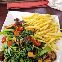 Stir-fried veg and tofu, chips instead of rice at Ladybird Restaurant Hotel Cafe in Lao Cai
