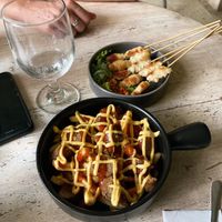 Hot dog fries, satay  at Sauce Tree Kuta in Kuta