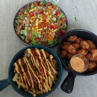 Cauli wings, salchizpapas, and mixed salad at Sauce Tree Kuta in Kuta