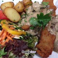 Seitan-Schnitzel ('Hunter Style') with roasted potatoes and salad at Ecco in Cologne