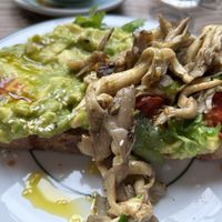Avocado on toast with oyster mushrooms  at Evelyn's in Manchester