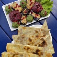 Lobiani and the spread platter with eggplant with walnuts   at Nektari in Tskaltubo