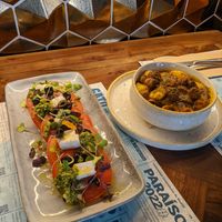 feta salad and chimichurri potatoes at Distrito Vegano Invernadero in Madrid