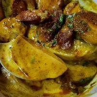 Patatas con "chorizo" at Distrito Vegano Invernadero in Madrid