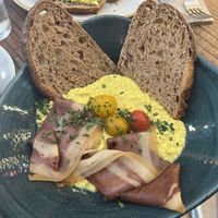 tofu scramble with bacon (€5 more)  at Distrito Vegano Invernadero in Madrid