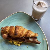English croissant + iced chai latte   at Distrito Vegano Invernadero in Madrid