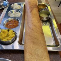 Potato dosa - dosa is empty and potatoes are the yellow on the side   at Saravanaa Bhavan in Rome