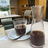 French press (European coffee poster behind)  at moxxa.caffè in Cologne