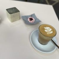 Oat milk flat white with almond thing  at moxxa.caffè in Cologne