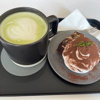 Matcha latte with oat milk and chocolate brownie. The cream on top was divine!   at Nuldam Space - 널담은공간 경복궁점 in Seoul