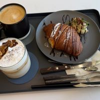 (clockwise from top left) Hot latte; matcha croissant, specialty almond latte  at Nuldam Space - 널담은공간 경복궁점 in Seoul