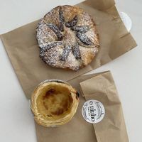 Front pastel de nata back chocolate pastry   at O Ninho Family Bar in Lagos