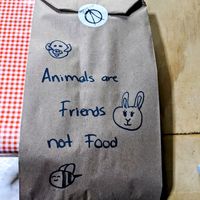 Hand-drawn artwork on each to-go bag 💖 at V De Vegano  in Mexico City