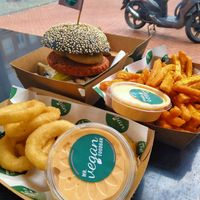 Super yummy gooische burger, sweet potato fries and onion rings, all of these with a side of sriracha-mayo at Mr. Vegan Foodbar in Groningen