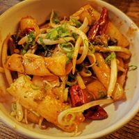 Chilli drive cakes, wok fried with pickles, smoky dry chili, garlic and homemade sauce at The Real Wan in Glasgow