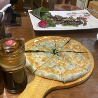 A “pie” with chinese spinach and mushrooms  at Fu Hui Ci Yuan Vegetarian Restaurant in Beijing
