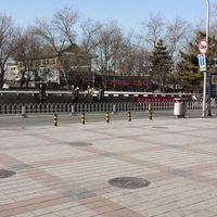 Turn right here on Dong'anmen St. This is standing next to Golden Jaguar noted in the directions at Fu Hui Ci Yuan Vegetarian Restaurant in Beijing