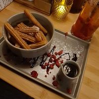 Churros mit Schokosauce at Daintree in Kempten