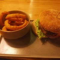 Pea Diddy with multigrain bun and onion rings at Daintree in Kempten