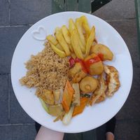 Fried rice, chips, sweet n sour chicken, dumplings and water chestnuts with tofu and bamboo shoots at Vegan House in Pudsey