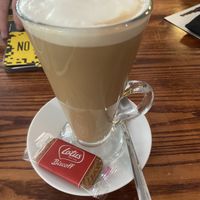 Latte with soy milk and a biscoff biscuit  at Fog on The Tyne in Gateshead