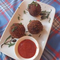 Pomballen with homemade spicy tomato sauce at The Old Soul in Amsterdam