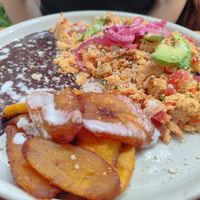 Huevos mexicanos with fried plátanos, beans and vegan almond "cheese" at Hierba Santa in Tuxtla Gutierrez