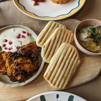 Sweet potato pancakes (left), naan bread (middle) and baba ghanoush at Uferlos in Stein Am Rhein