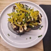 vegetable kimbap volcano roll: kimchi kimbap roll topped with pulled shiitake mushroom, pickled pineapple, chives and mayo at Yo! Sushi - Trafford in Manchester