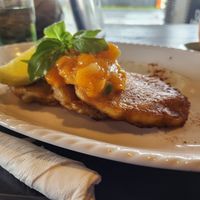 Corn and kūmara fritters with papaya salsa at Flying Turtle Cafe in Rarotonga