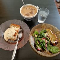 Rhubarb pie, a potato pie with a lil' salad, and an iced latte. Everything tastes way better than their looks! 🍰 at Kahvila Rakastan in Helsinki