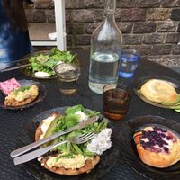 Lunch plate with salad and two Karelian pies with different toppings  at Kahvila Rakastan in Helsinki