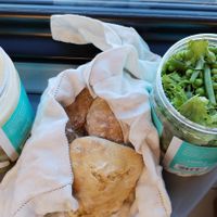 Soup with carrots and potatoes, very rich + sourdough bread + tofu cream, baked potatoes, and the salad of peas and beans, all in one container. Normally you can sit on the terrace at Kahvila Rakastan in Helsinki