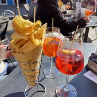 Patatas y aperol spritz  at Trexento in Burano