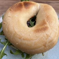 Hommus and caramelised onion bagel  at CBCB & ODFUB in Brunswick