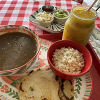 Sopa negra, pupusa, jugo de mango y maracuyá  at Sopitas in San Jose