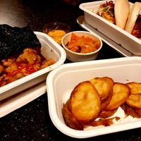 Grilled cauliflower. kimchi, vegan Bao, and fried potato at Bao Brothers in Bratislava